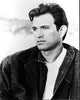 Black and white photo print of Chris Isaak in denim shirt and jacket