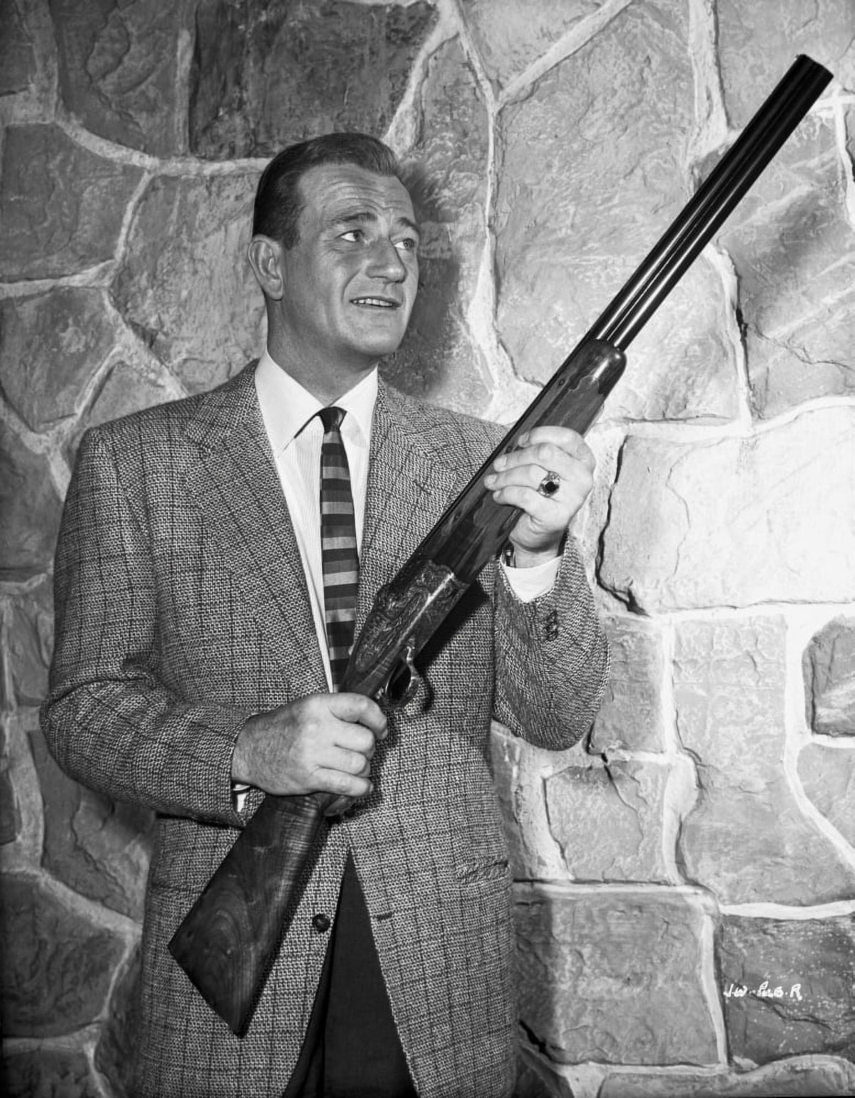 John Wayne photo print with rifle, classic Western icon.