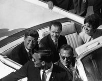 Photo print of John F. Kennedy and Jackie Kennedy in a car, capturing a historic moment.