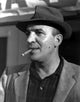 Telly Savalas smoking a cigar photo print, classic cinema art.