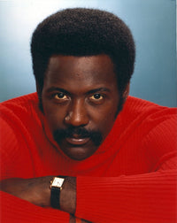 Richard Roundtree close-up portrait photo print in red jacket.