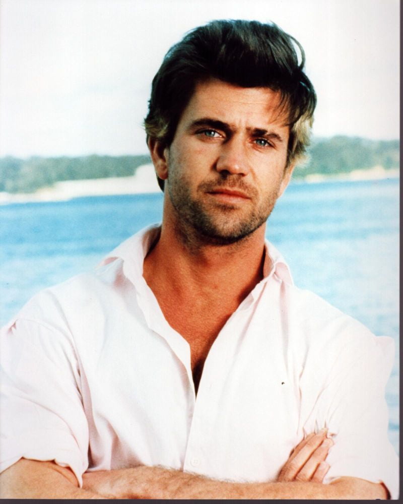 Mel Gibson photo print in pink shirt with arms crossed