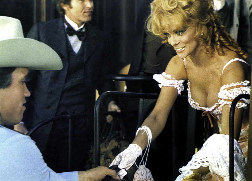 Photo print of Arnold Schwarzenegger and Ann-Margaret in The Villain