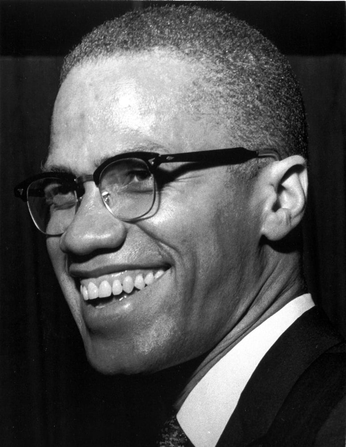 Malcolm X smiling photo print, available in multiple sizes.