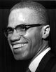 Malcolm X smiling photo print, available in multiple sizes.
