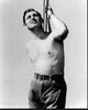 Black and white photo print of Clark Gable shirtless holding rope.