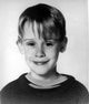 Macaulay Culkin Home Alone 2 photo print showcasing a classic movie scene.