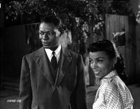 Nat King Cole film still photo print capturing classic music history.