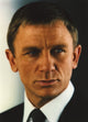 Daniel Craig portrait photo print in black tuxedo, elegant decor.