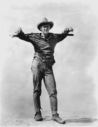 Steve McQueen iconic photo print with a gun, available in multiple sizes.