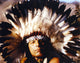 Iron Cody posed in Indian feather hat photo print