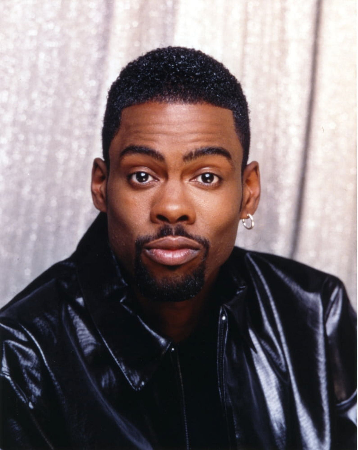 Close-up portrait photo print of Chris Rock in a leather jacket.