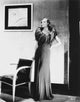 Joan Crawford wearing a gown with a feather collar photo print.