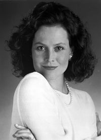 Sigourney Weaver photo print in white tunic and necklace