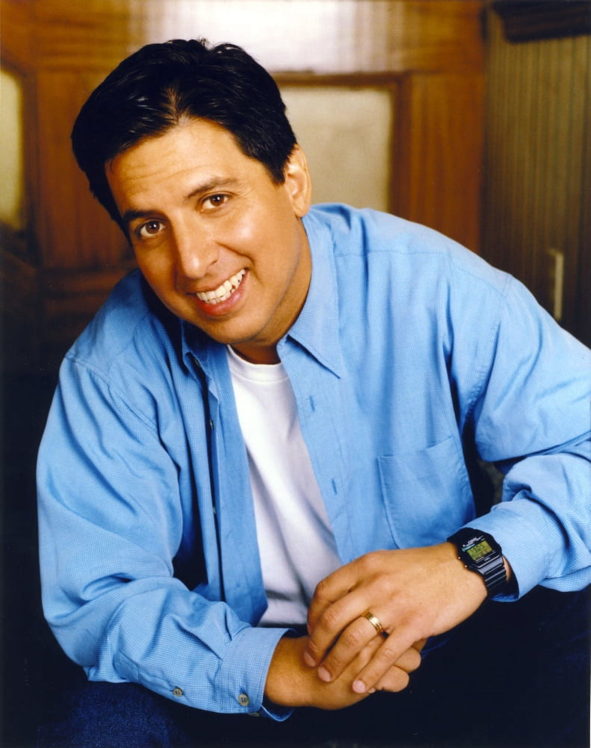 Ray Romano smiling portrait photo print wearing blue long sleeves.