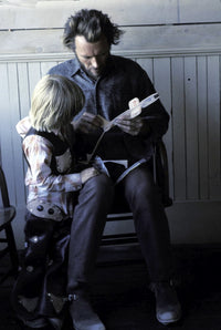Clint Eastwood building a toy airplane with his son photo print.