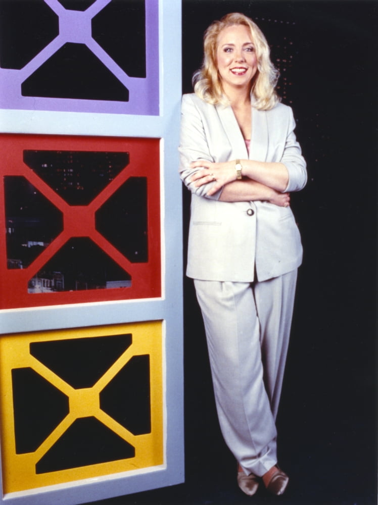 Brett Butler photo print in white blazer and slacks.