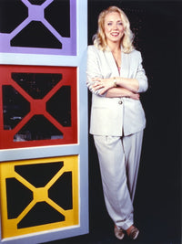 Brett Butler photo print in white blazer and slacks.