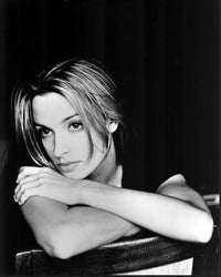 Black and white photo print of Lisa Marie sitting backwards on a chair.