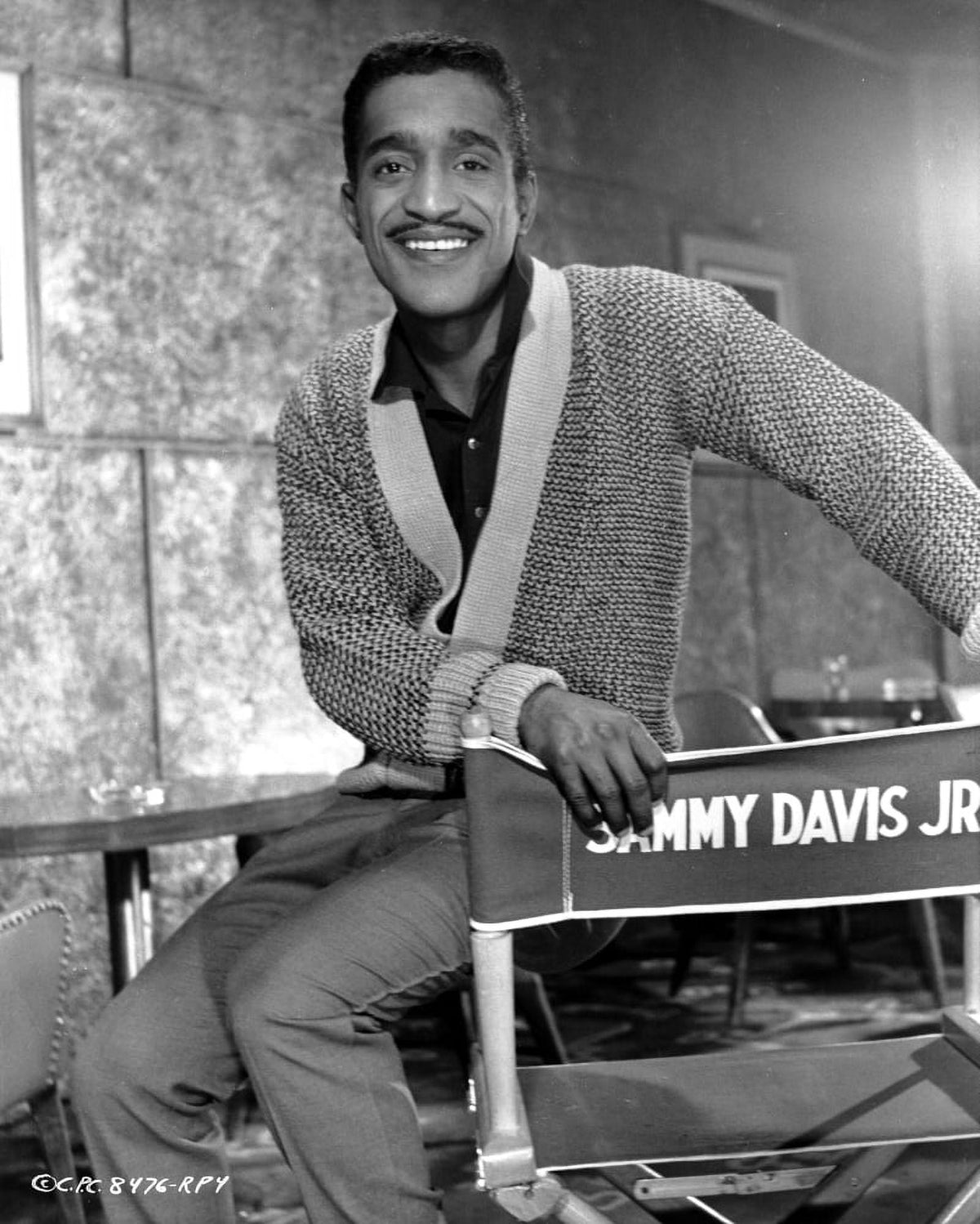 Sammy Davis Jr. seated on a director's chair photo print.