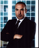 Rick Hoffman in black suit photo print with blue tile background