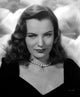 Ella Raines portrait photo print featuring a smiling image with a necklace.