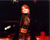 Shania Twain performing on stage in an animal print outfit photo print