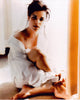 Neve Campbell sitting photo print in elegant pose with button down off shoulder.