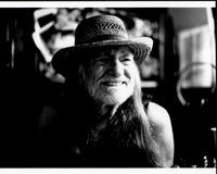 Willie Nelson black and white photo print smiling in straw hat.