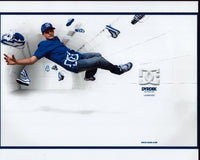 Rob Dyrdek floating photo print in blue and white DC sneakers.
