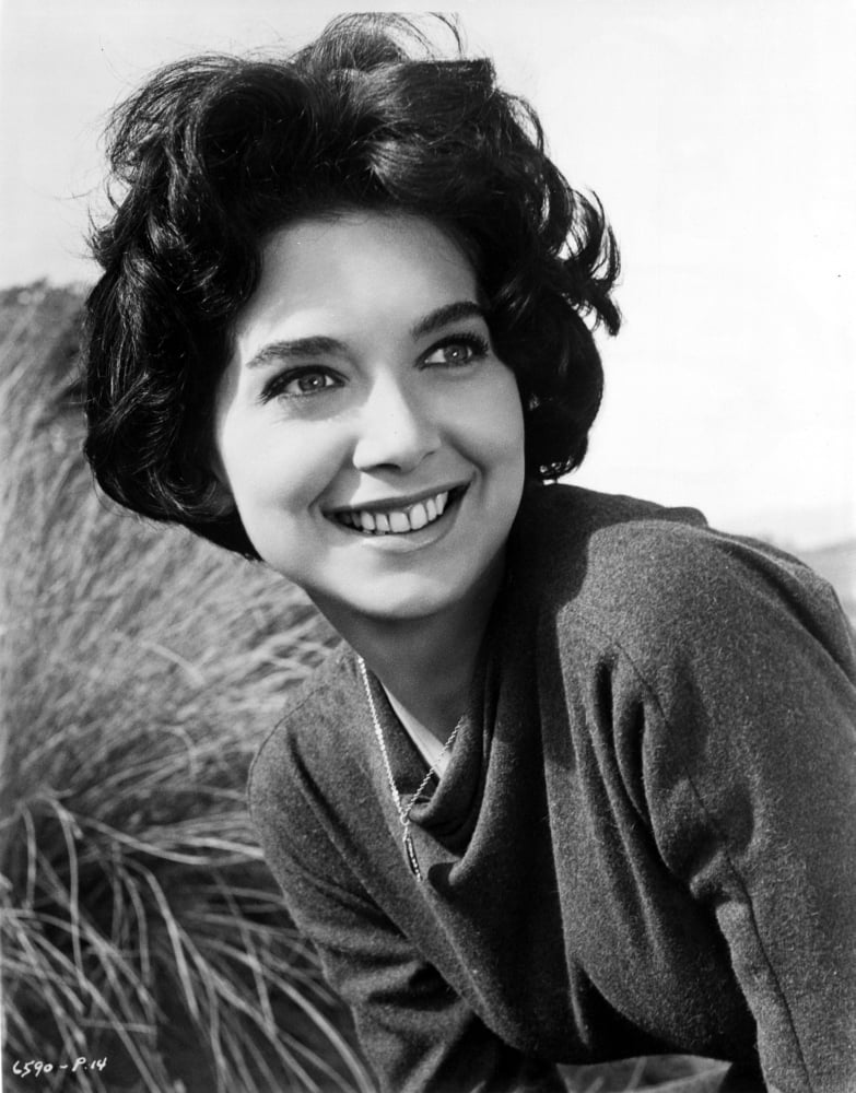 Suzanne Pleshette wearing a long sleeve blouse on grass photo print