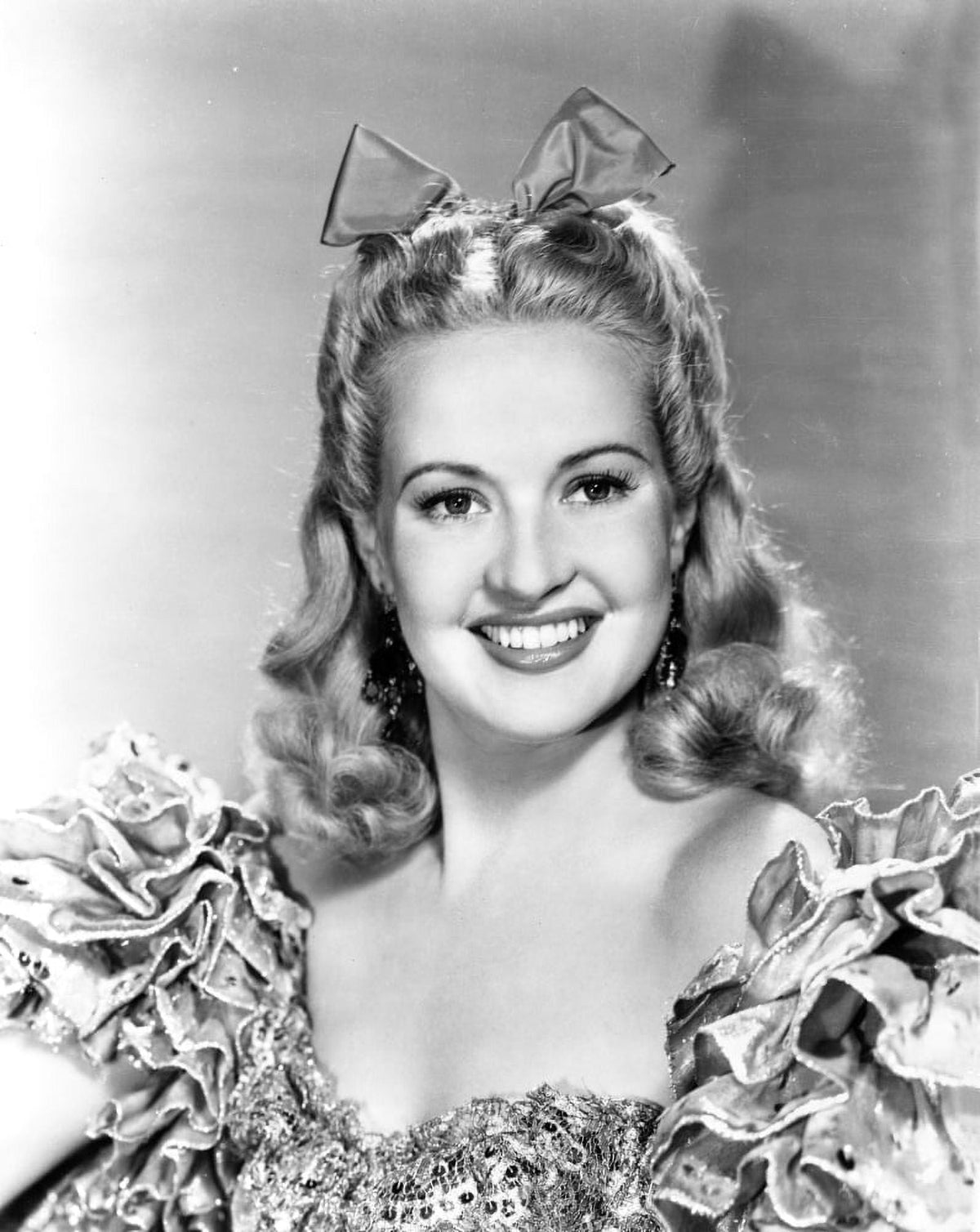 Betty Grable posing in a glamorous dress vintage photo print.