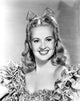 Betty Grable posing in a glamorous dress vintage photo print.