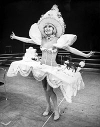 Carol Channing wearing a white puff sleeve dress photo print.