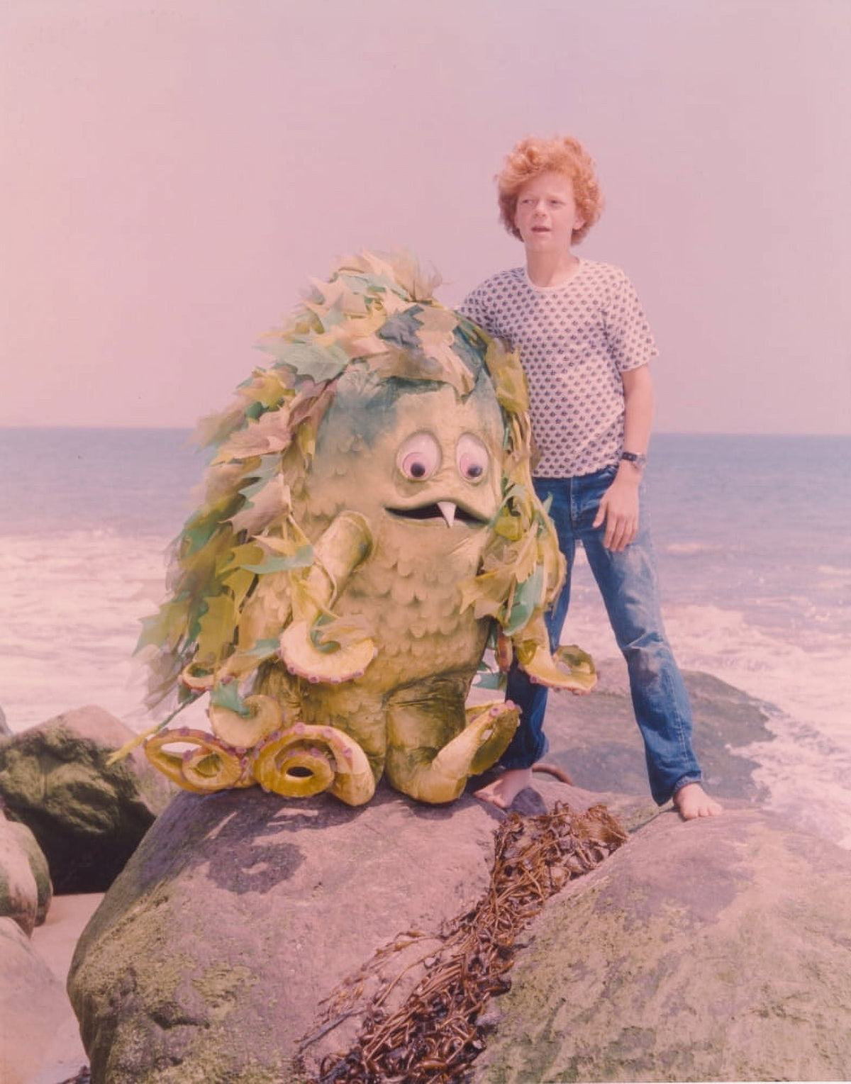 Sigmund and the Sea Monster movie scene photo print featuring characters standing on a rock in the sea.