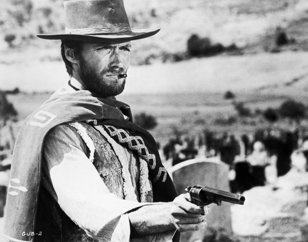 Clint Eastwood posed in cowboy attire with pistol photo print