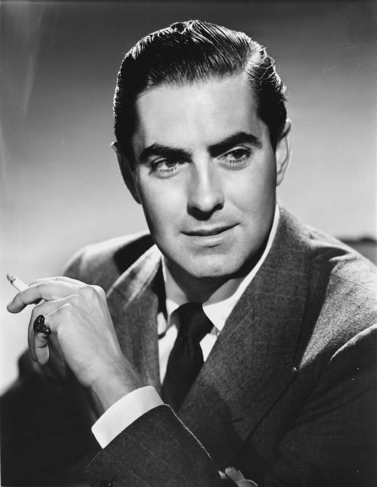 Tyrone Power smoking photo print capturing classic Hollywood charm