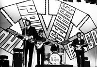 The Beatles performing live photo print, capturing the essence of the iconic band.