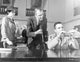 Black and white photo print of Anatomy of a Murder movie scene showing a woman observing two men testing evidence.