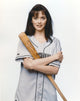 Julia Campbell portrait photo print with baseball bat on white background.