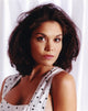 Close-up portrait photo print of Paula Trickey in a white polka dot dress.