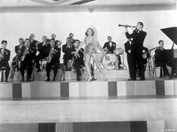 Artie Shaw performing on stage with a dancer photo print