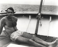 Sean Connery sunbathing on a boat photo print.