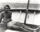 Sean Connery sunbathing on a boat photo print.