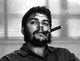 Che Guevara smoking a cigar photo print showcasing revolutionary imagery.