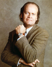Kelsey Grammer showing his watch in a formal outfit photo print
