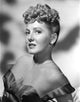 Jean Arthur portrait photo print in a slightly reclining pose.