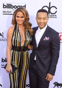 Chrissy Teigen and John Legend arriving at the Billboard Music Awards photo print.