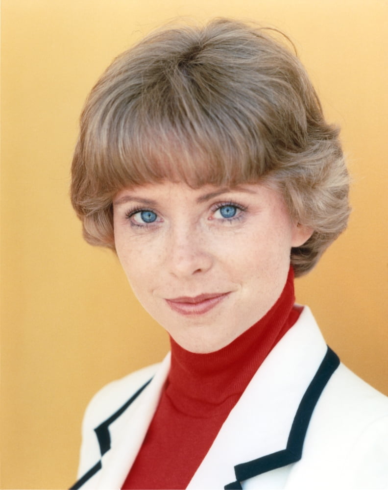 Lauren Tewes posed elegantly in a white coat photo print