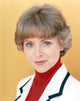 Lauren Tewes posed elegantly in a white coat photo print